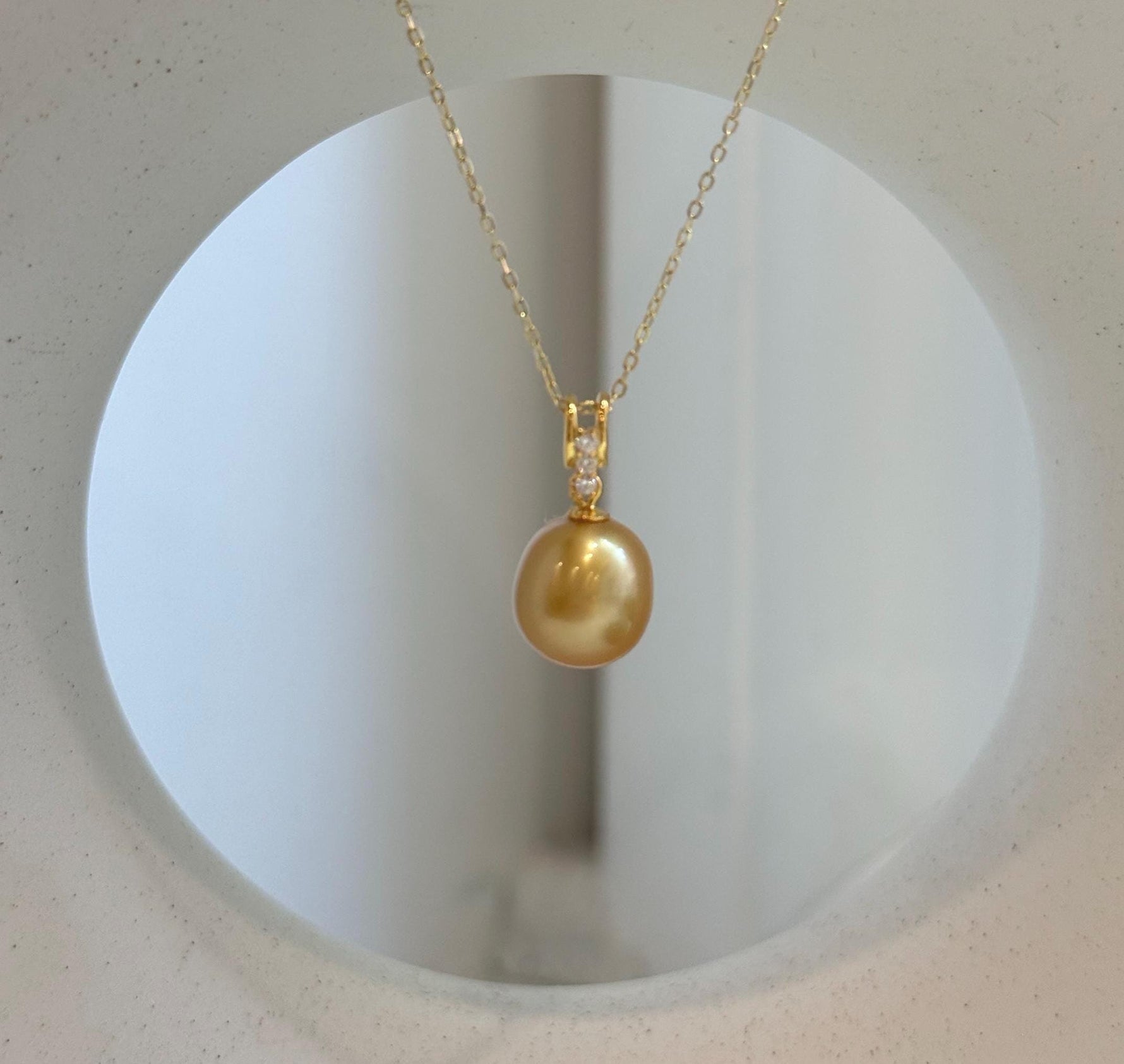 Genuine 10.2mm South Sea deep gold pearl pendant with mirror luster and gold-plated S925 sterling silver.