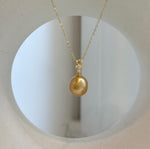 Genuine ocean pearl pendant handcrafted with a natural deep gold South Sea pearl and gold-plated silver.