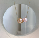 Close-up of high-luster Edison freshwater pearls with reflective mirror-like shine.