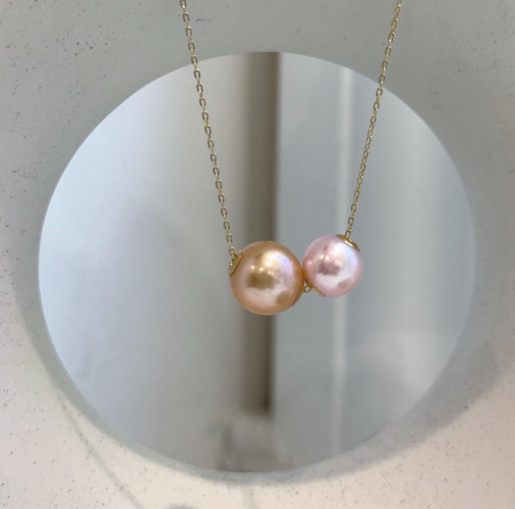 Close-up of high-luster Edison freshwater pearls with reflective mirror-like shine.