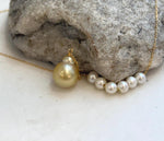 Luxury pearl drop necklace with brilliant mirror luster and sterling silver finish.
