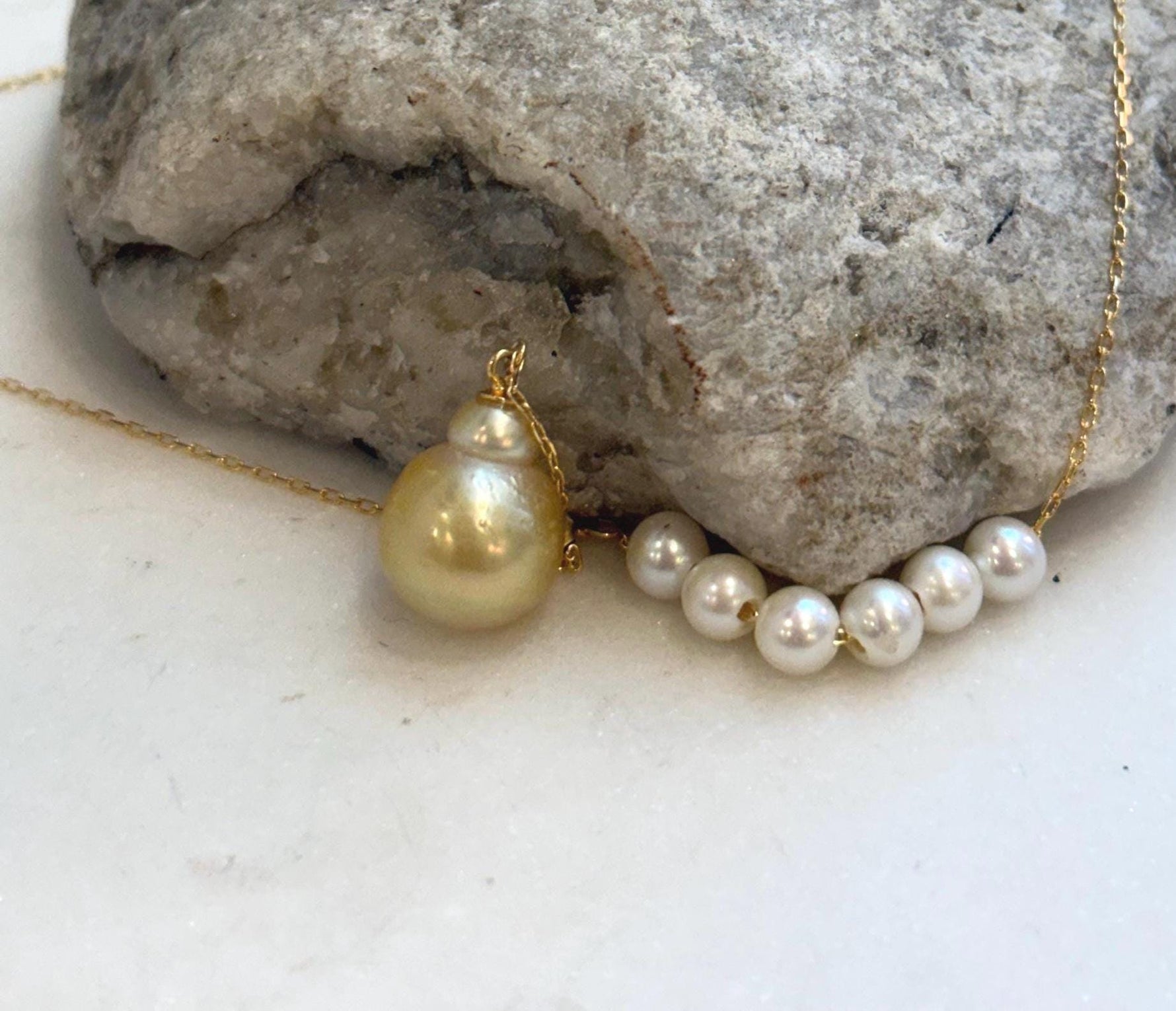 Luxury pearl drop necklace with brilliant mirror luster and sterling silver finish.
