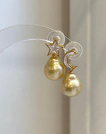 Close-up of genuine 11.4mm South Sea Golden Pearl earrings showing exceptional mirror luster.