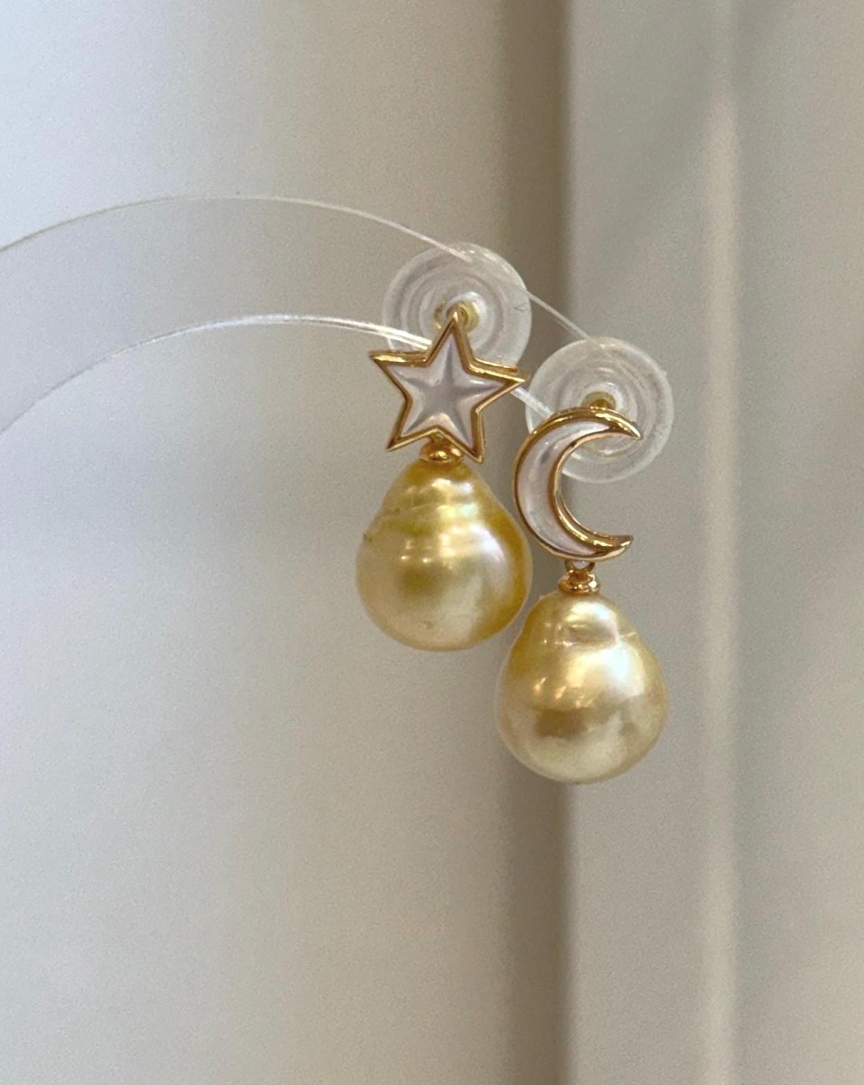 Close-up of genuine 11.4mm South Sea Golden Pearl earrings showing exceptional mirror luster.