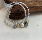 White pearl strand necklace with mixed ocean pearl centerpiece