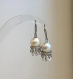 Luxury white pearl earrings featuring round Australian South Sea pearls