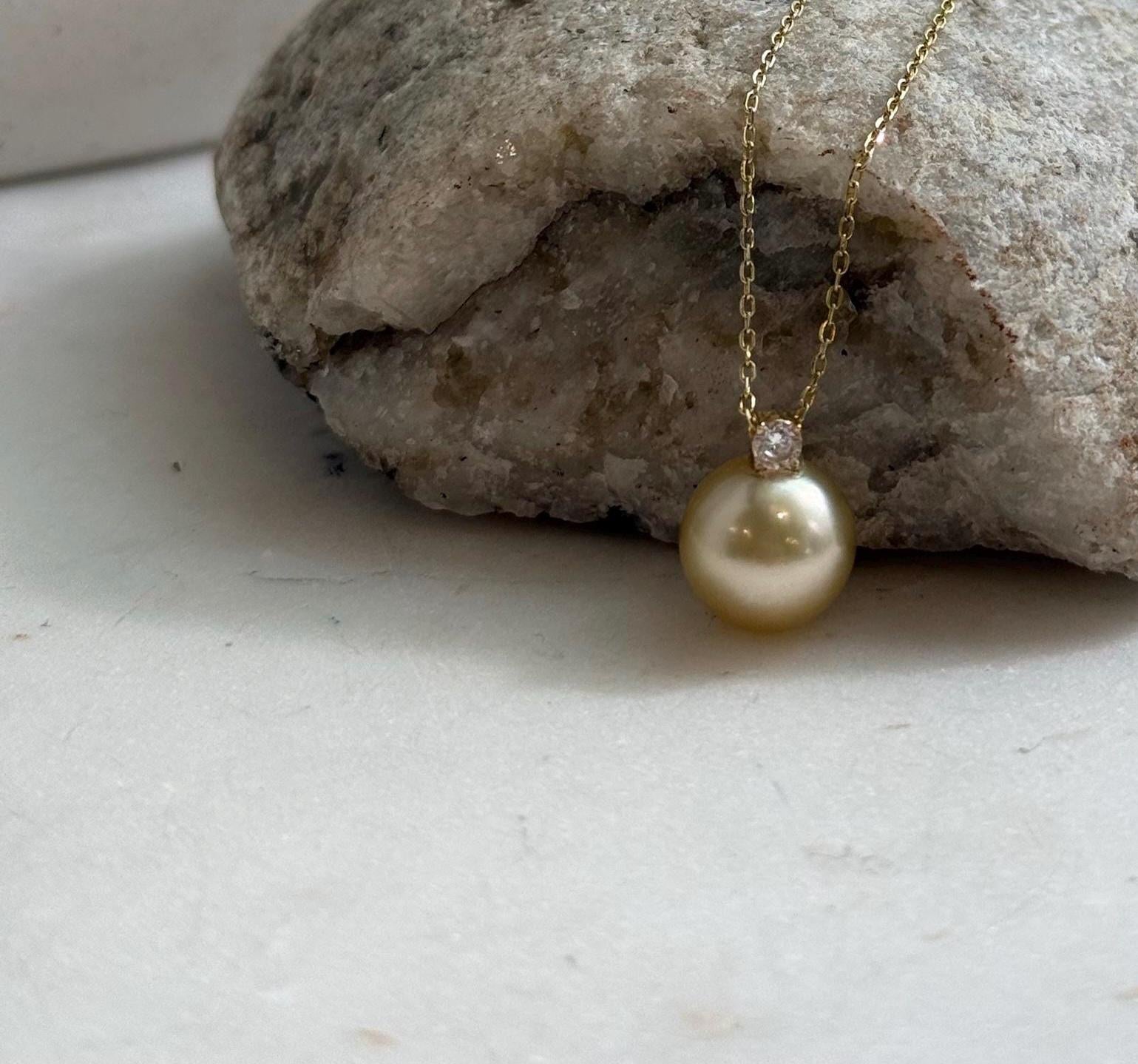 Fine jewelry featuring a genuine golden South Sea pearl pendant