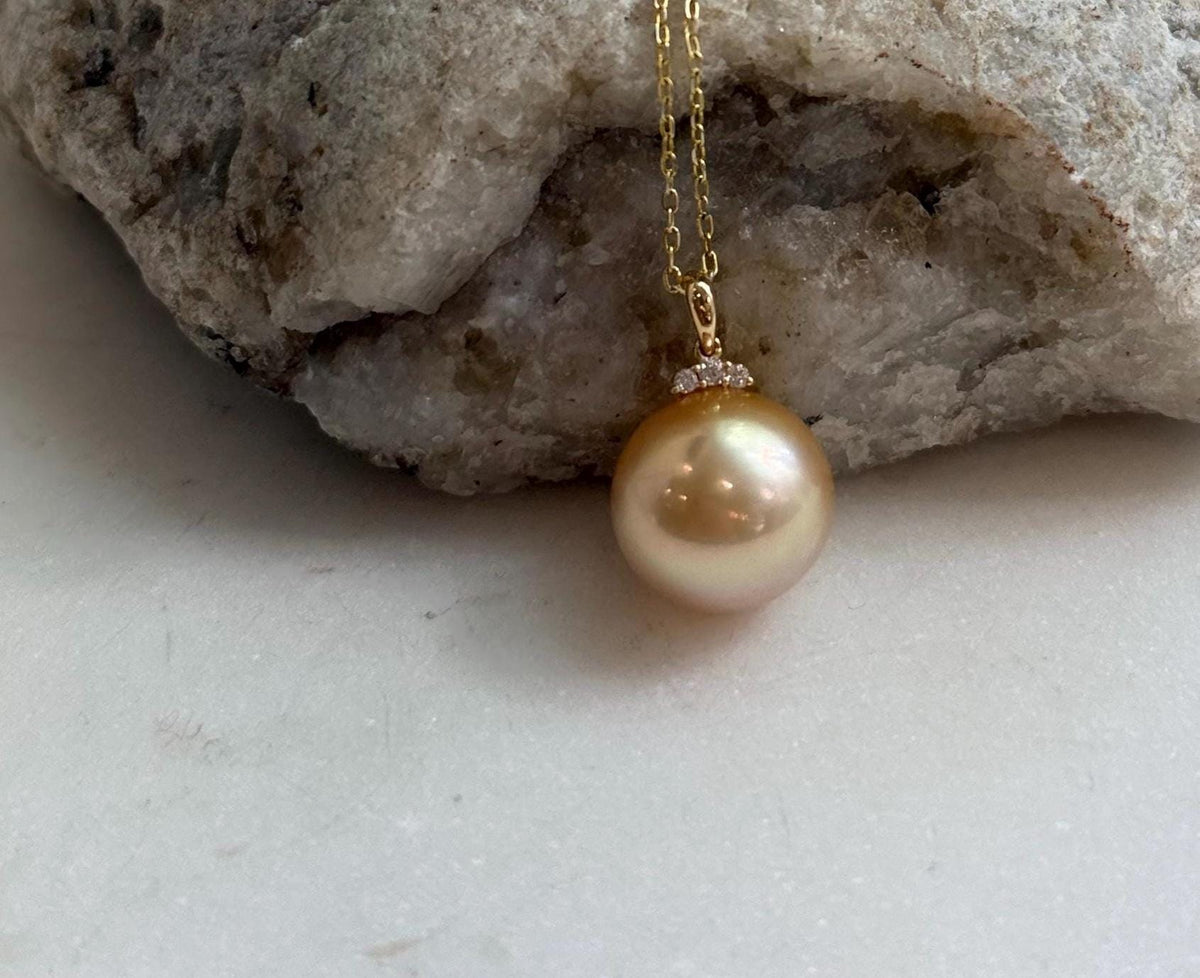 Fine jewelry featuring a genuine South Sea deep tea gold pearl pendant