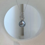 Platinum gray Tahitian pearl necklace with green-blue overtones and sterling silver chain.