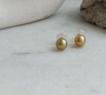 Deep gold South Sea pearl stud earrings in minimalist design