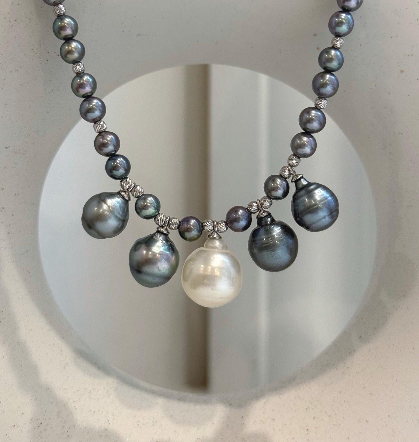 Luxury minimalist pearl necklace featuring five large ocean pearls