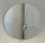 Elly’s 11.8mm Tahitian platinum pearl snake pendant with extreme mirror luster and S925 sterling silver setting.