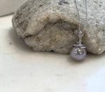 Genuine 11.8mm Tahitian saltwater pearl pendant featuring a unique sterling silver snake design.