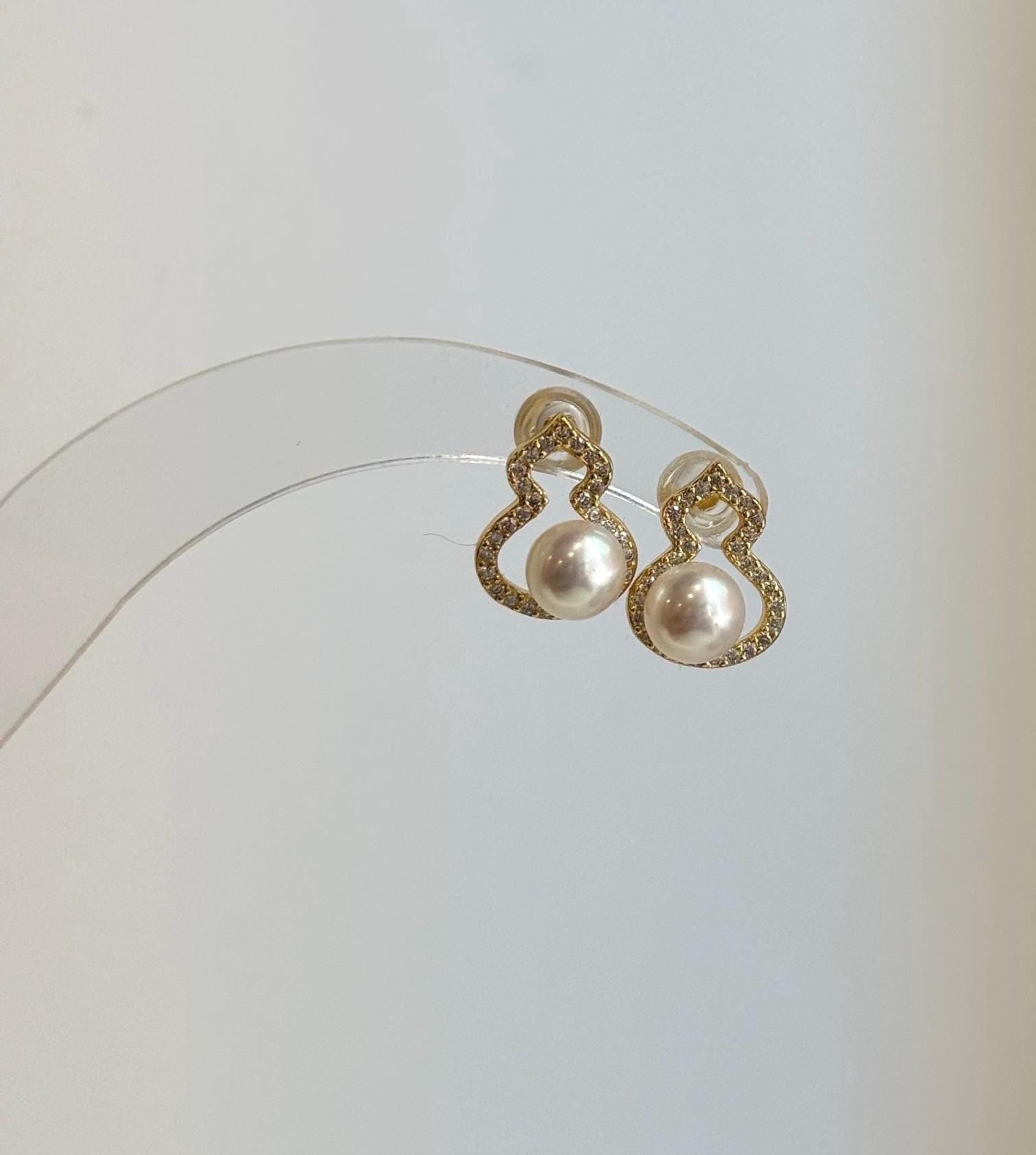 Elly's 6.2mm off white freshwater pearl gourd stud earrings with mirror luster on S925 sterling silver posts.
