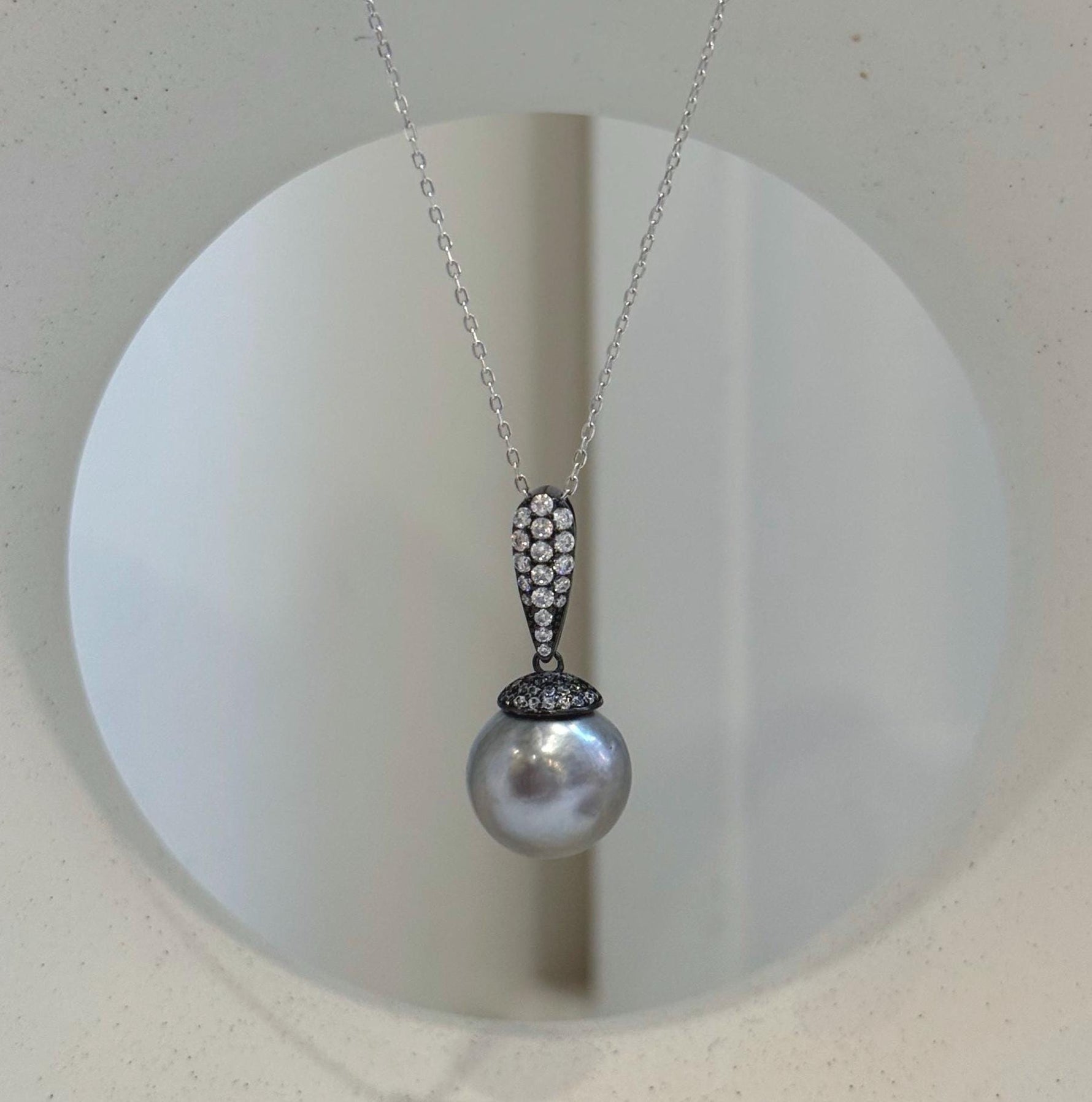 12. 5mm Tahitian platinum pearl cool pendant with extreme luster