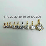 Moissanite solitaire pendant charms in 0.05 ct to 2.00 ct sizes shown beside ruler for size comparison.
