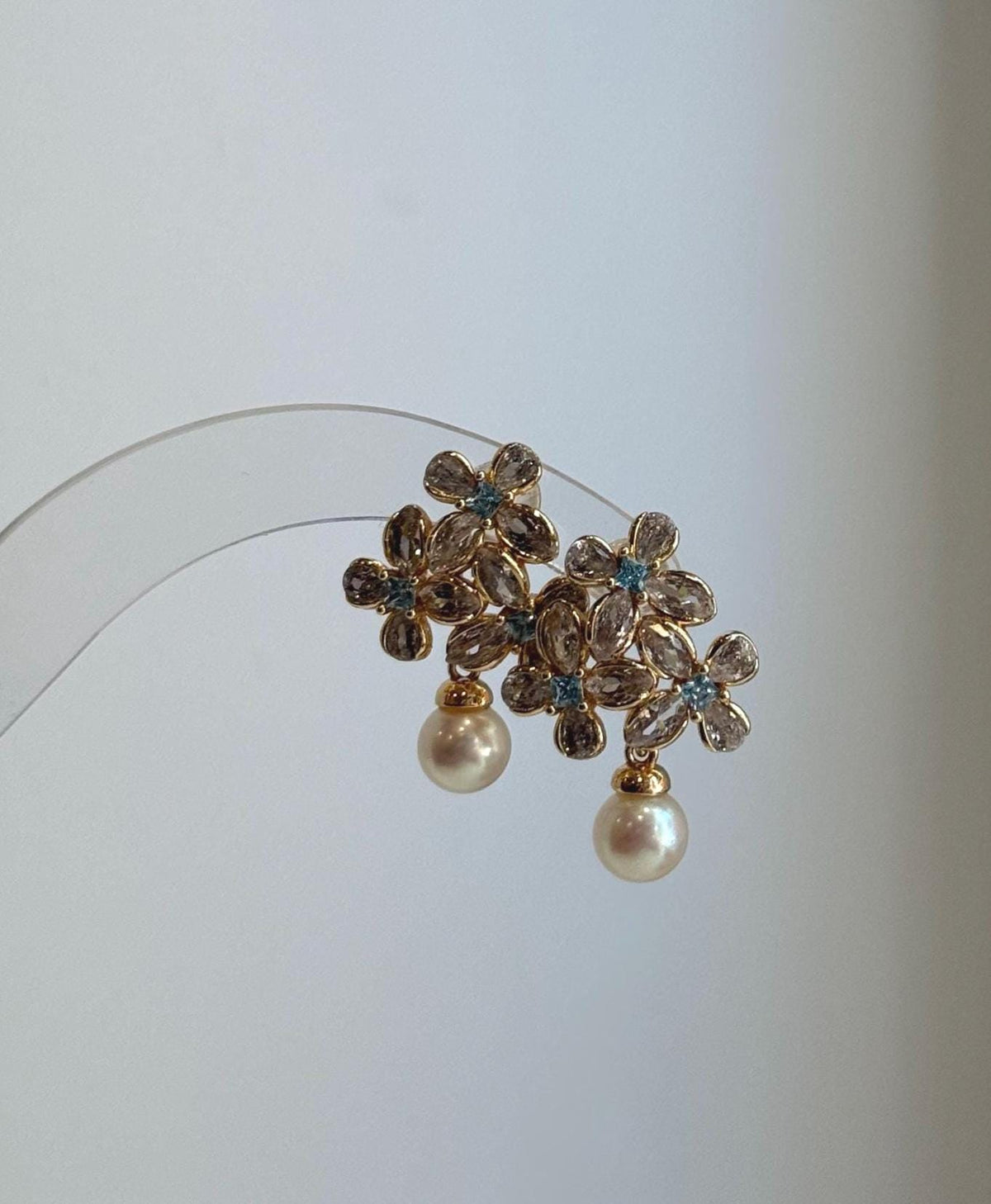 Genuine 6.4mm Akoya pearl flower stud earrings with brilliant mirror luster.