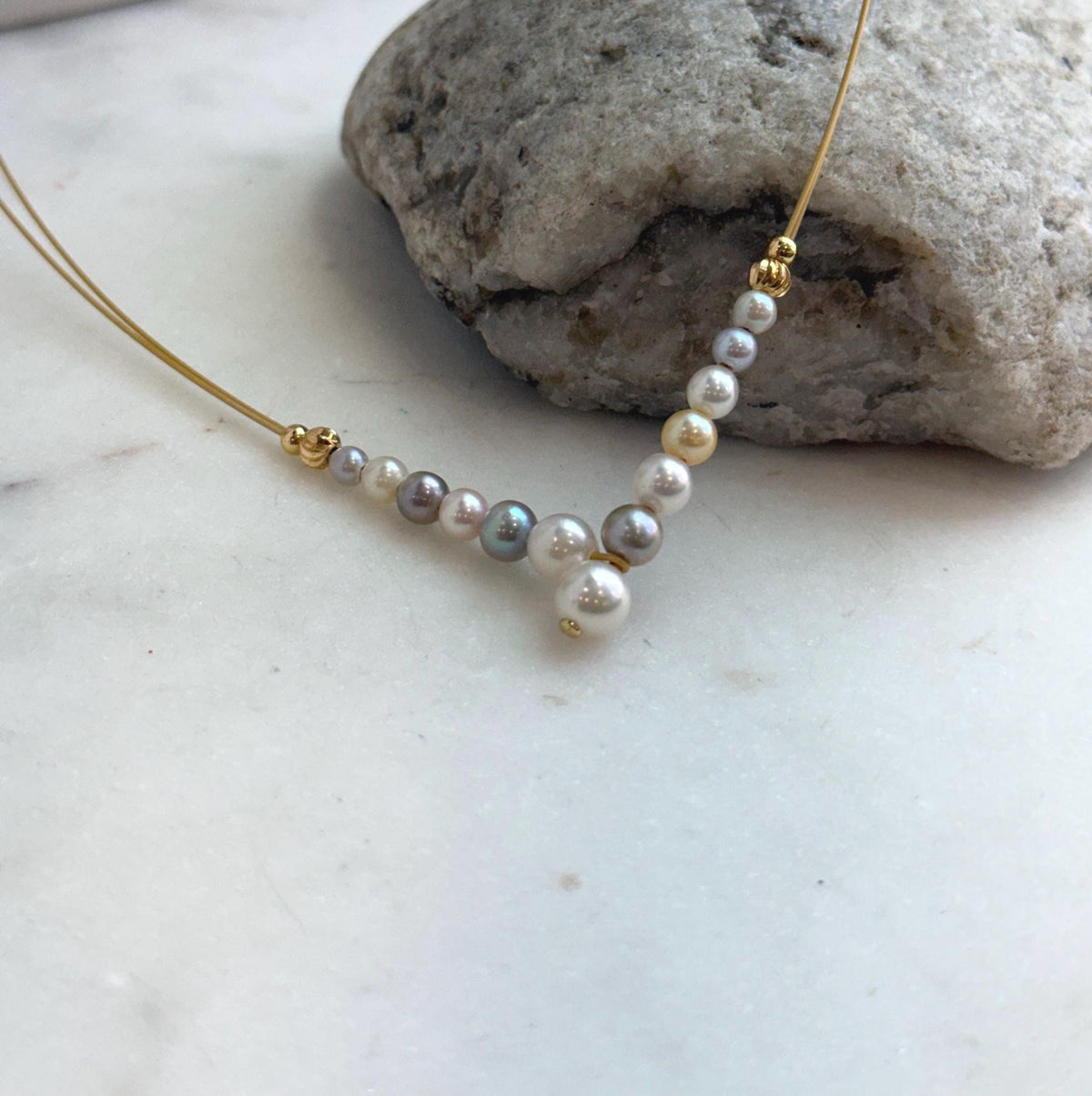 Natural Japanese Akoya saltwater pearl strand featuring colorful pearls.