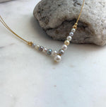 Natural Japanese Akoya saltwater pearl strand featuring colorful pearls.