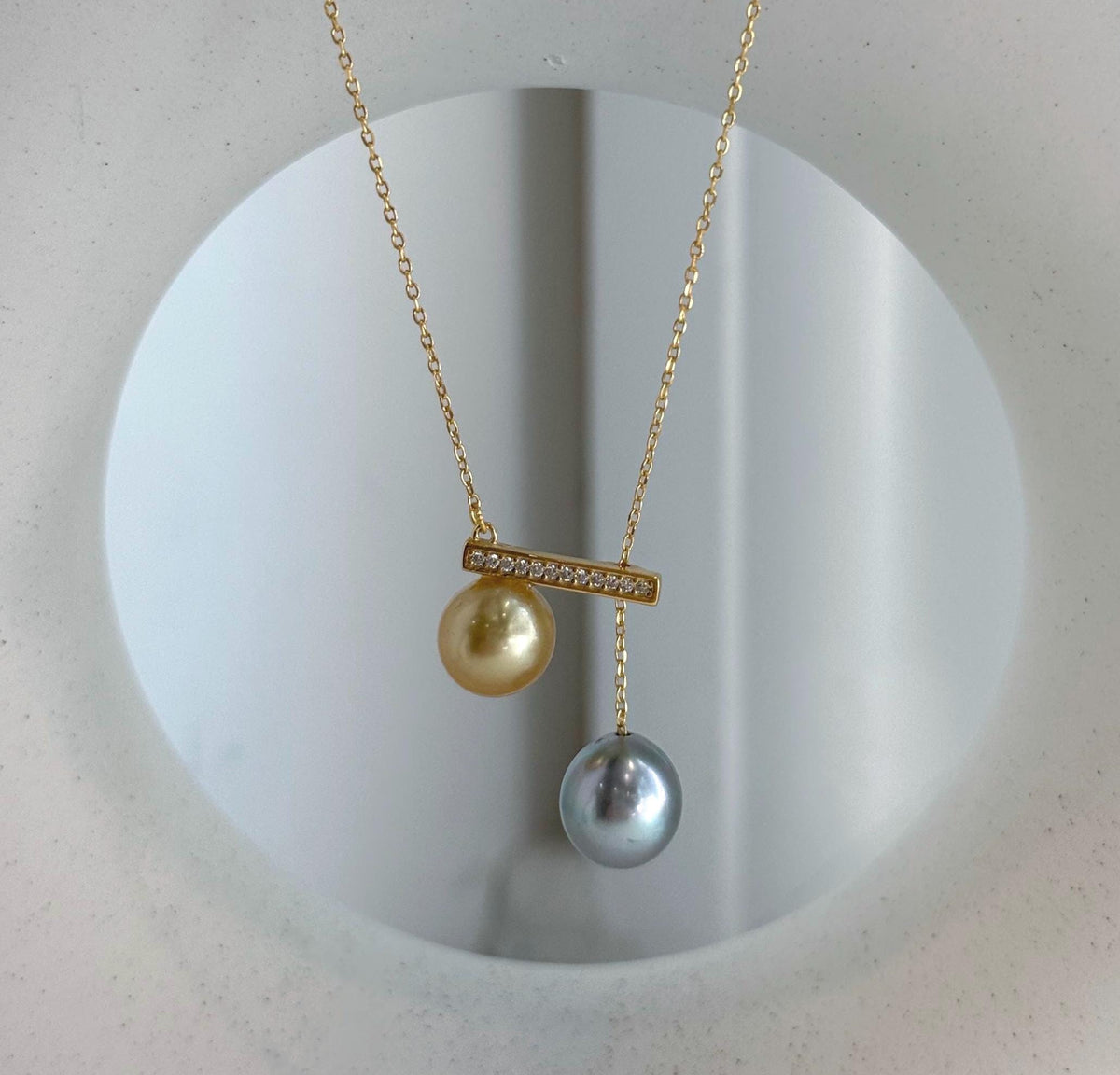 Double South Sea and Tahitian pearl pendant with mirror luster.