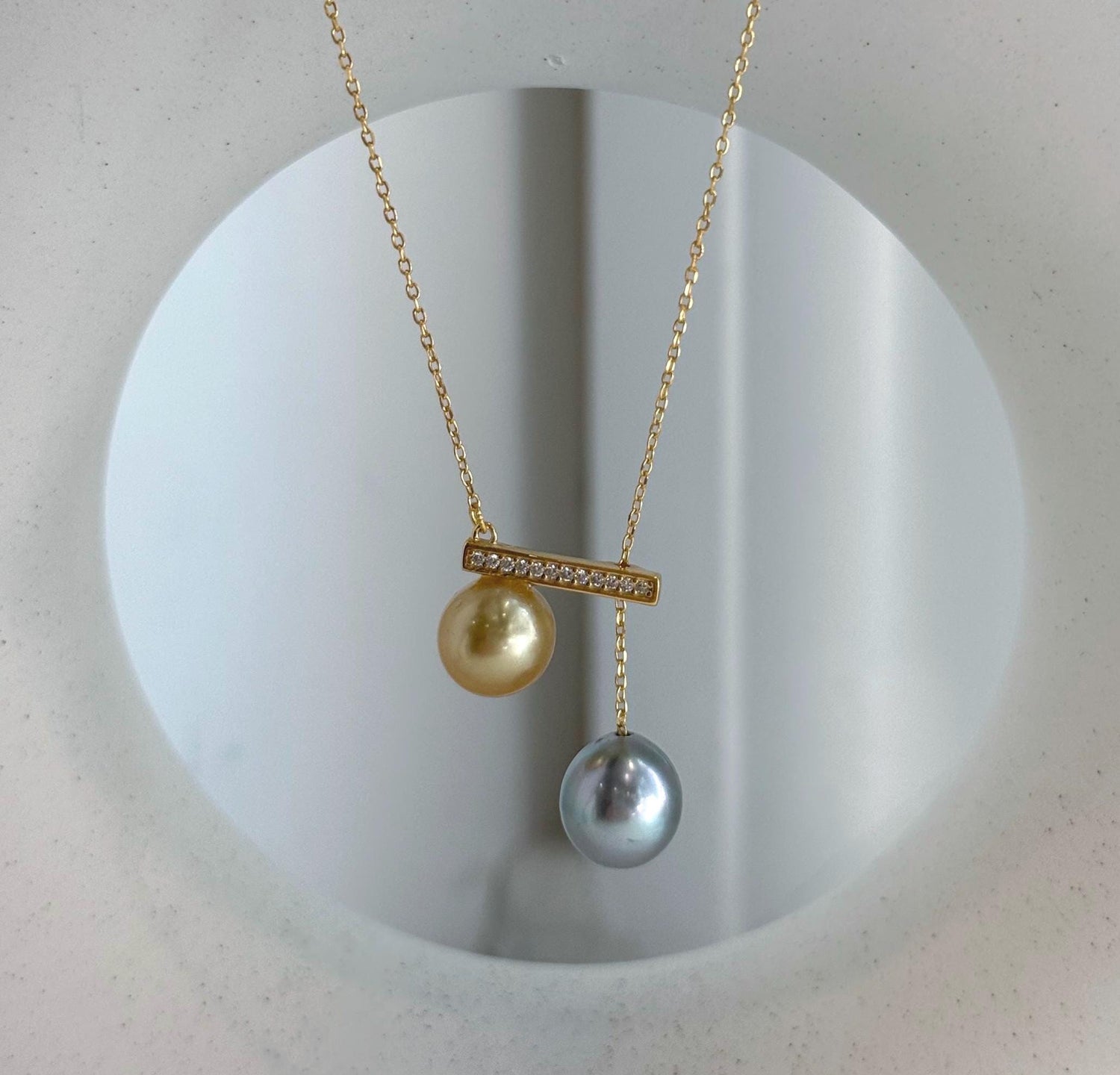 Double South Sea and Tahitian pearl pendant with mirror luster.