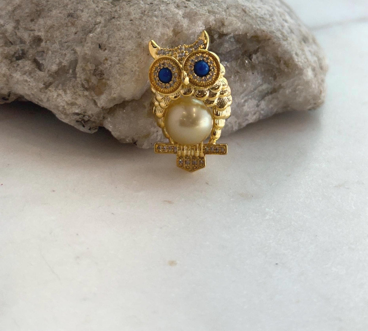 Luxury owl pearl brooch for coats, scarves, and blazers.