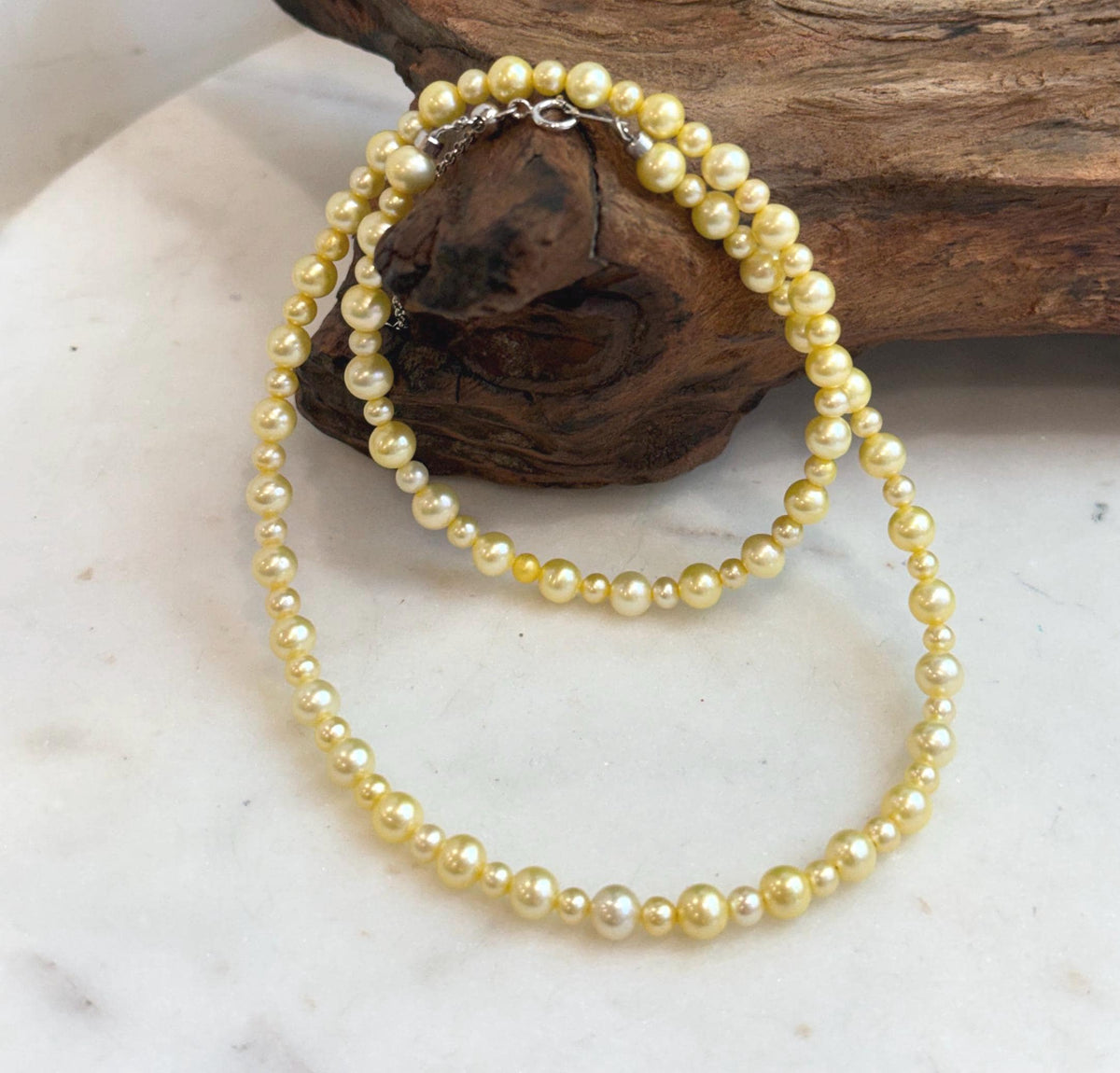 Genuine golden freshwater pearl strand necklace featuring naturally elegant warm tones.
