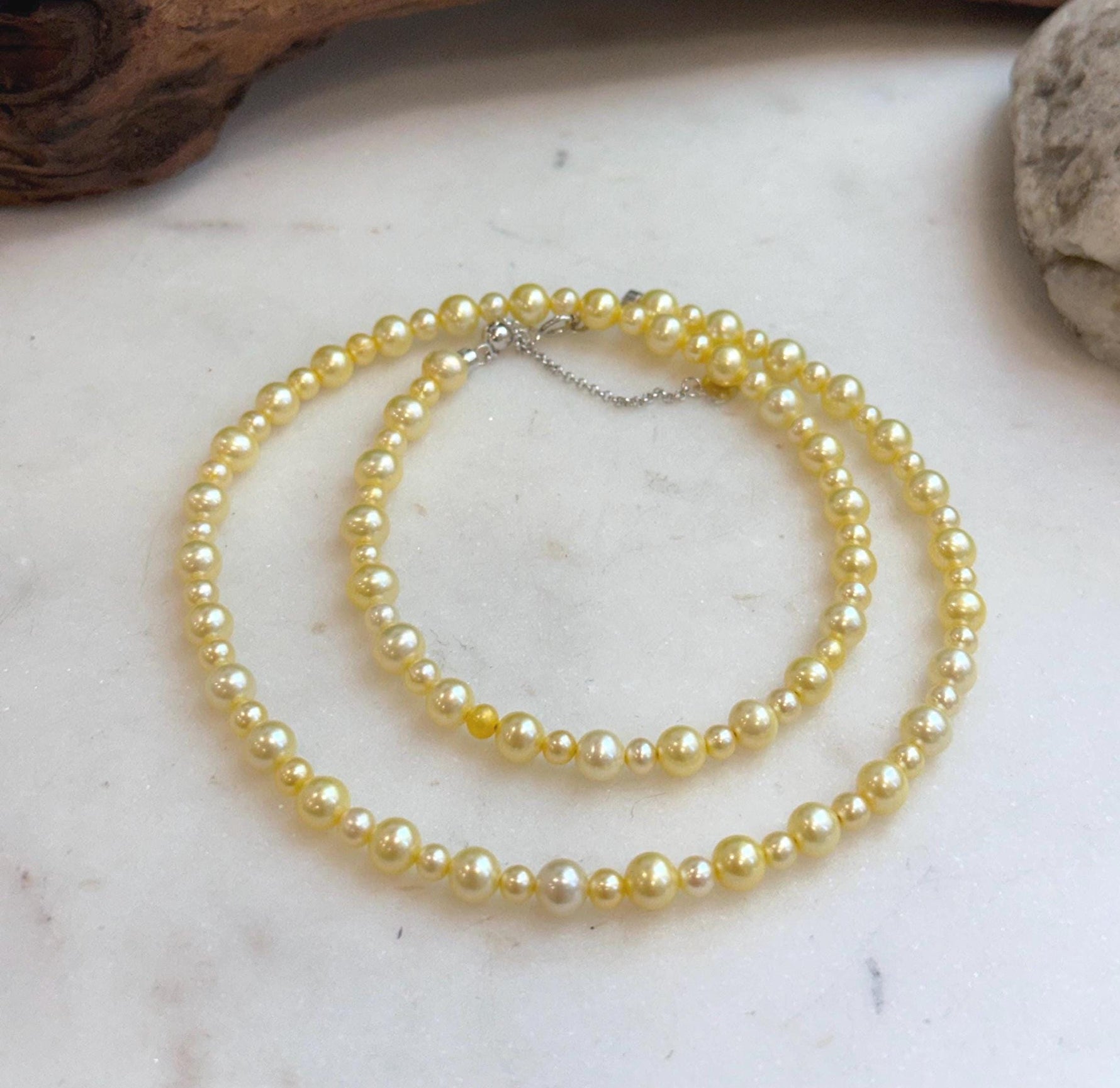 Dainty golden freshwater pearl strand necklace for women with classic timeless style.