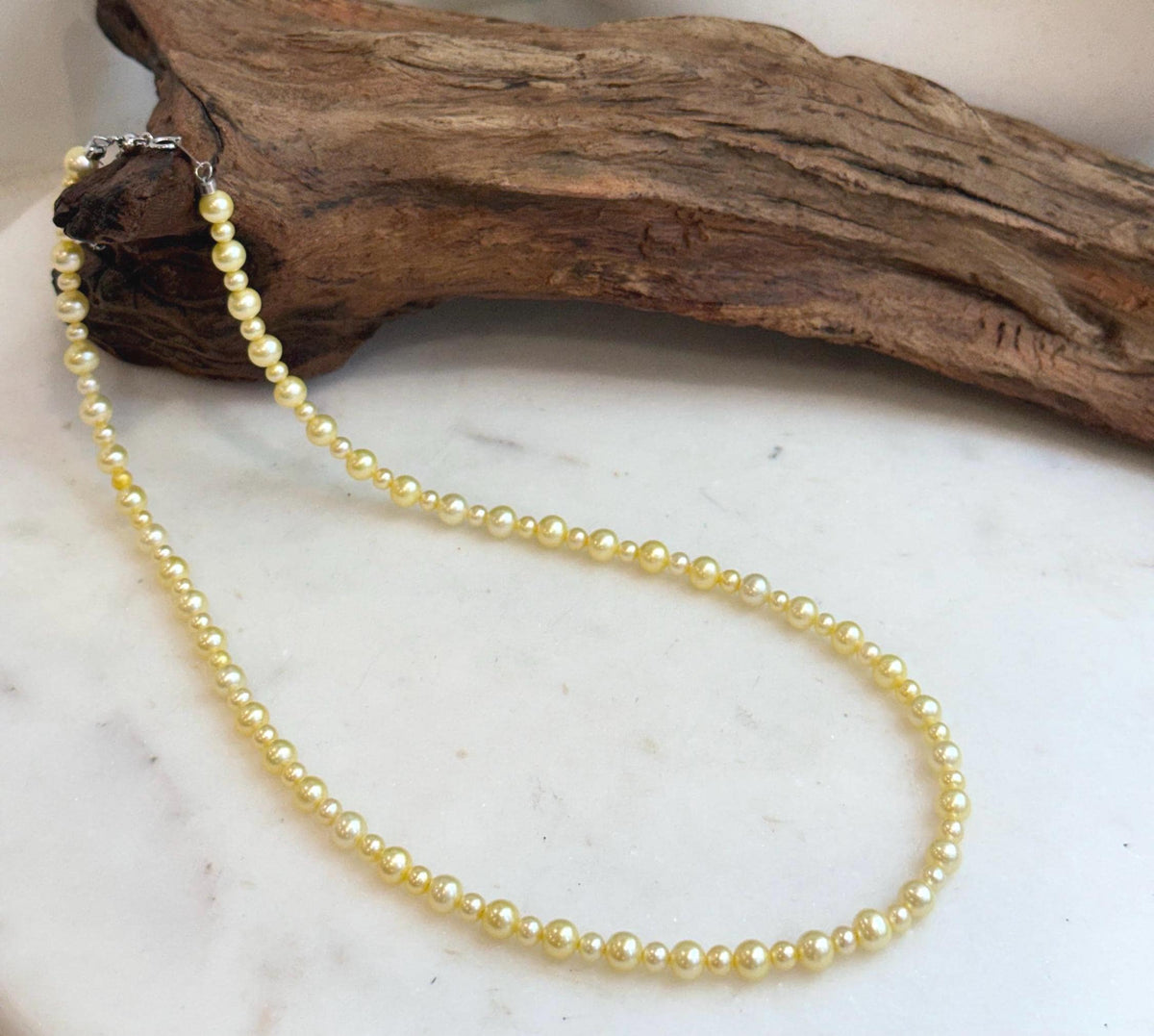 Lustrous golden freshwater pearls in graduated 3.5–5.7mm sizes.