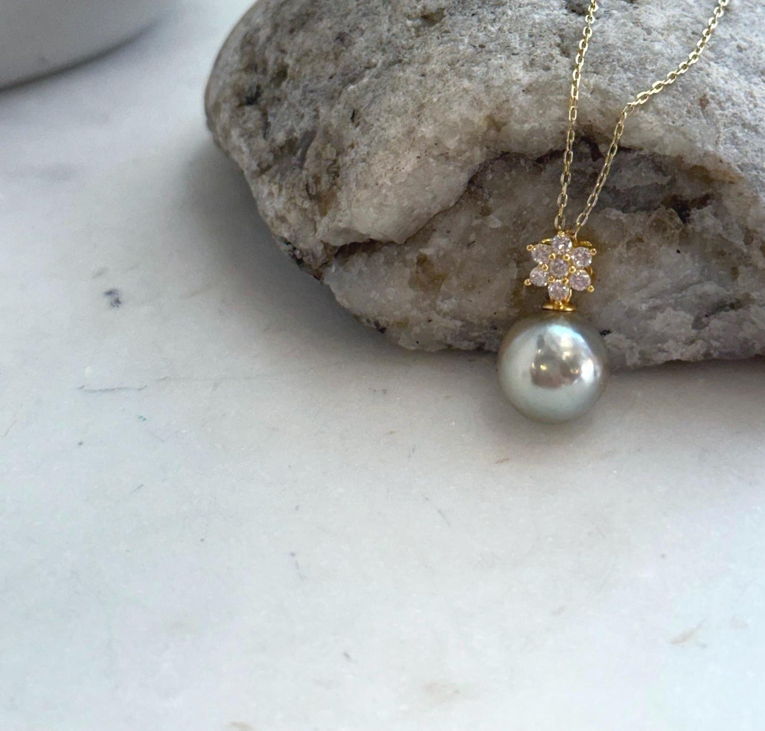 Elegant 11mm Tahitian pearl necklace with high mirror luster and sterling silver setting.