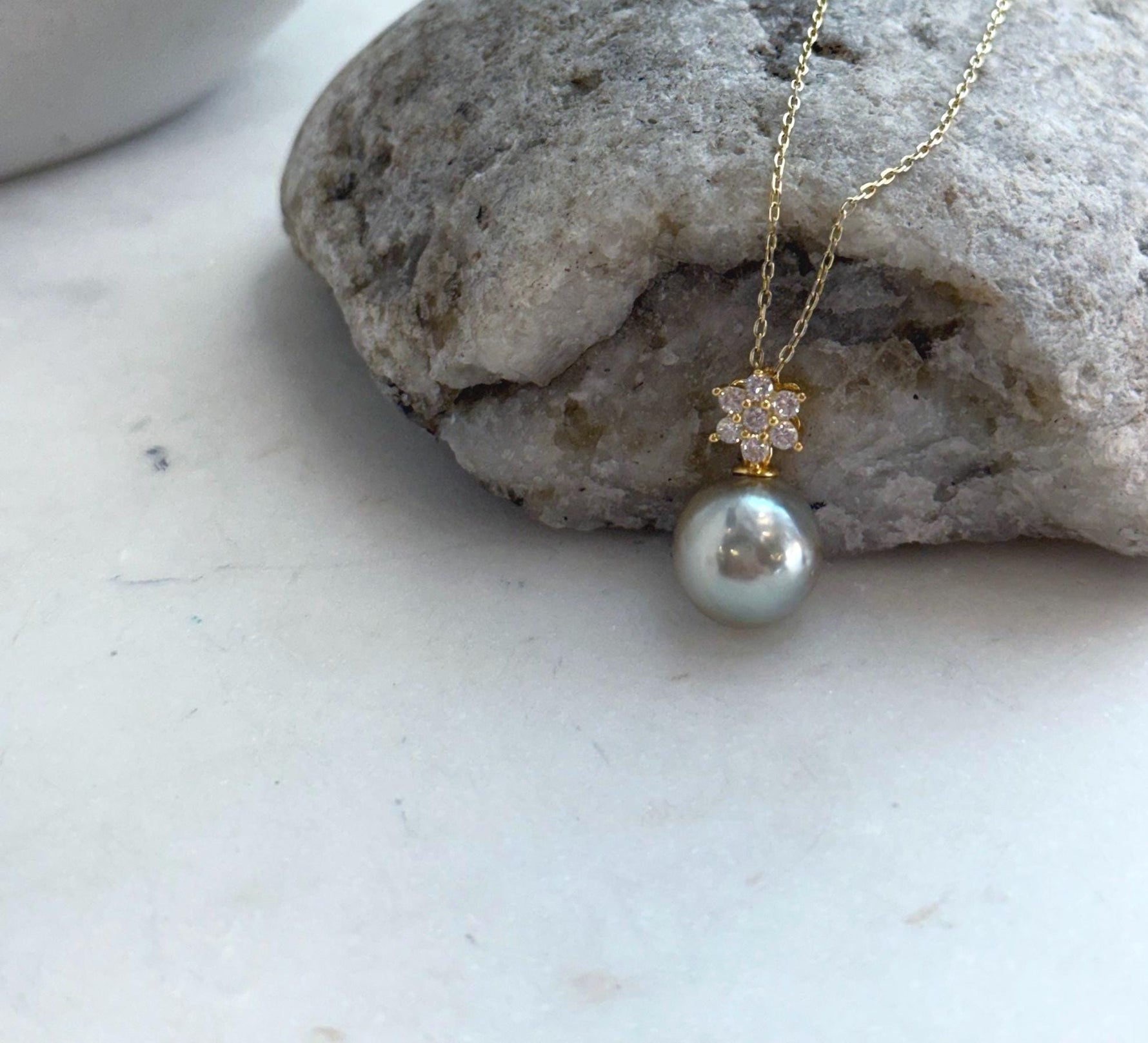 Minimalist sterling silver pendant featuring an 11mm genuine Tahitian saltwater pearl.