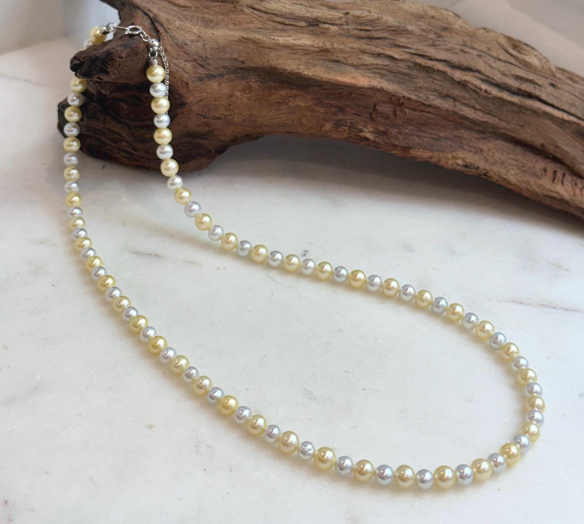 4. 3–5.5mm golden silver freshwater pearl necklace with mirror luster and S925 sterling silver clasp.