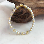 Small freshwater pearl bracelet featuring luminous mirror-like luster.