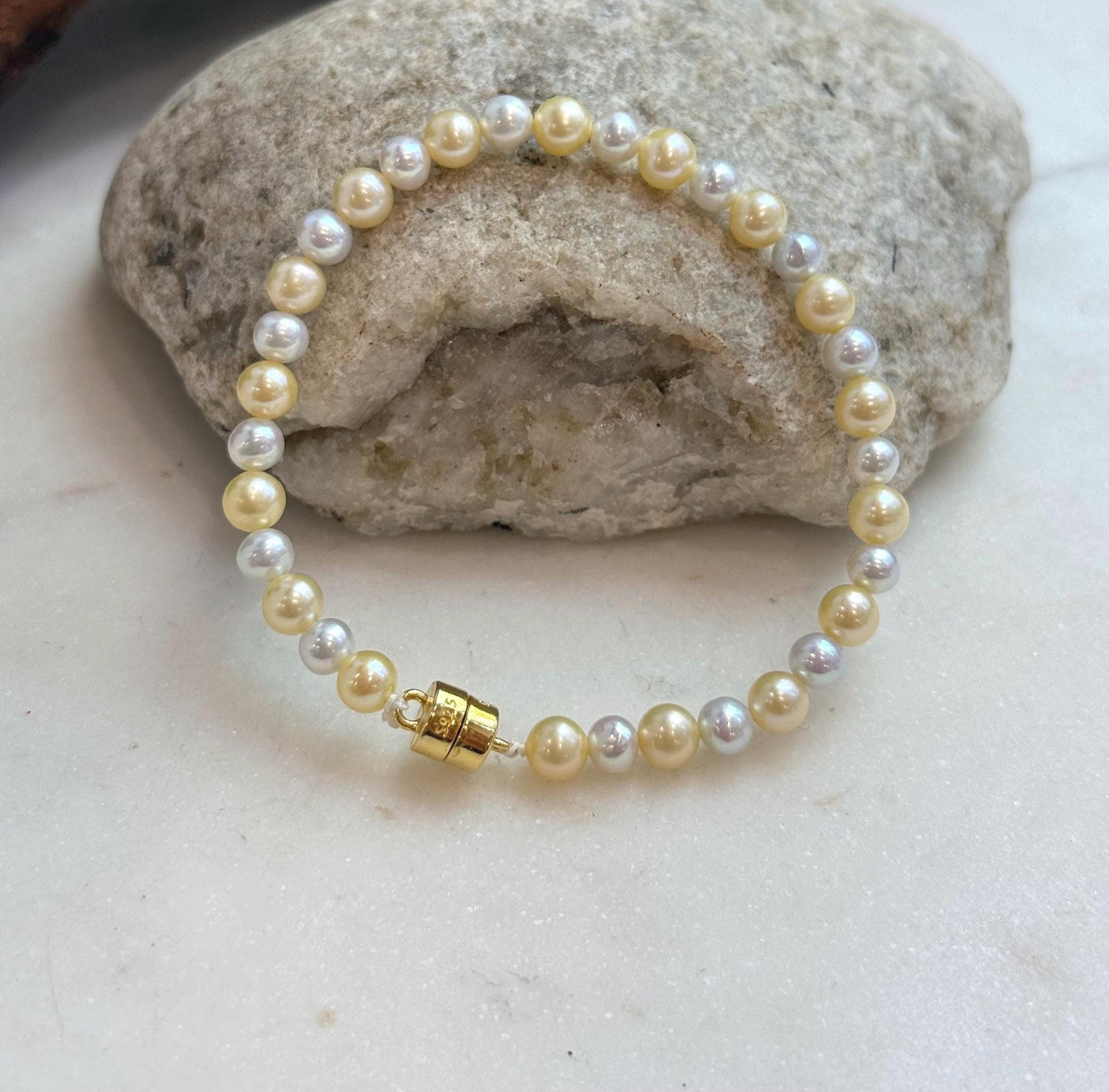 Elly’s 4.3–5.5mm golden silver freshwater pearl bracelet with mirror luster.