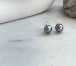 Minimalist Tahitian pearl stud earrings crafted with genuine ocean-grown pearls.