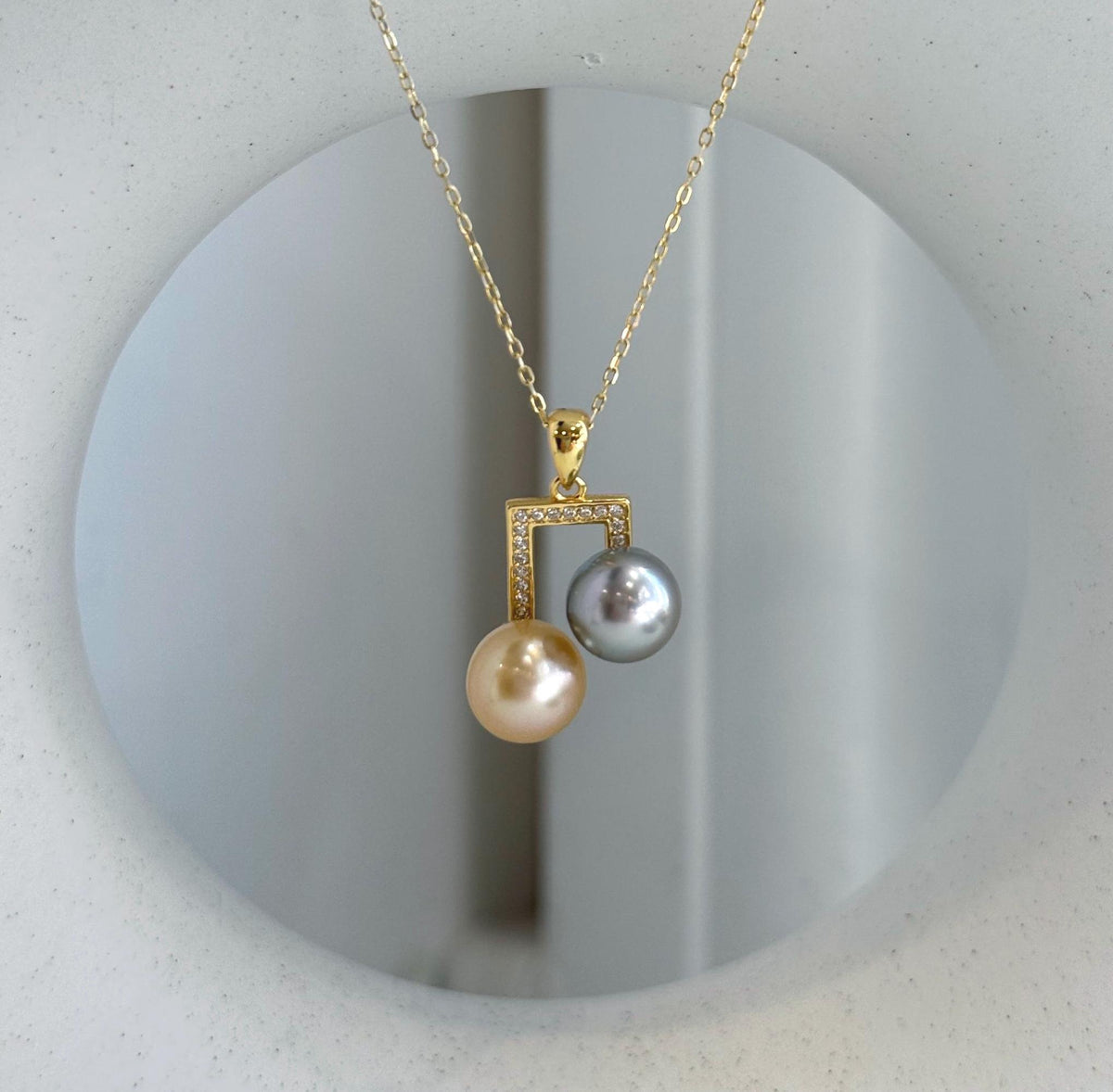 Modern double pearl necklace pendant crafted with genuine saltwater pearls.