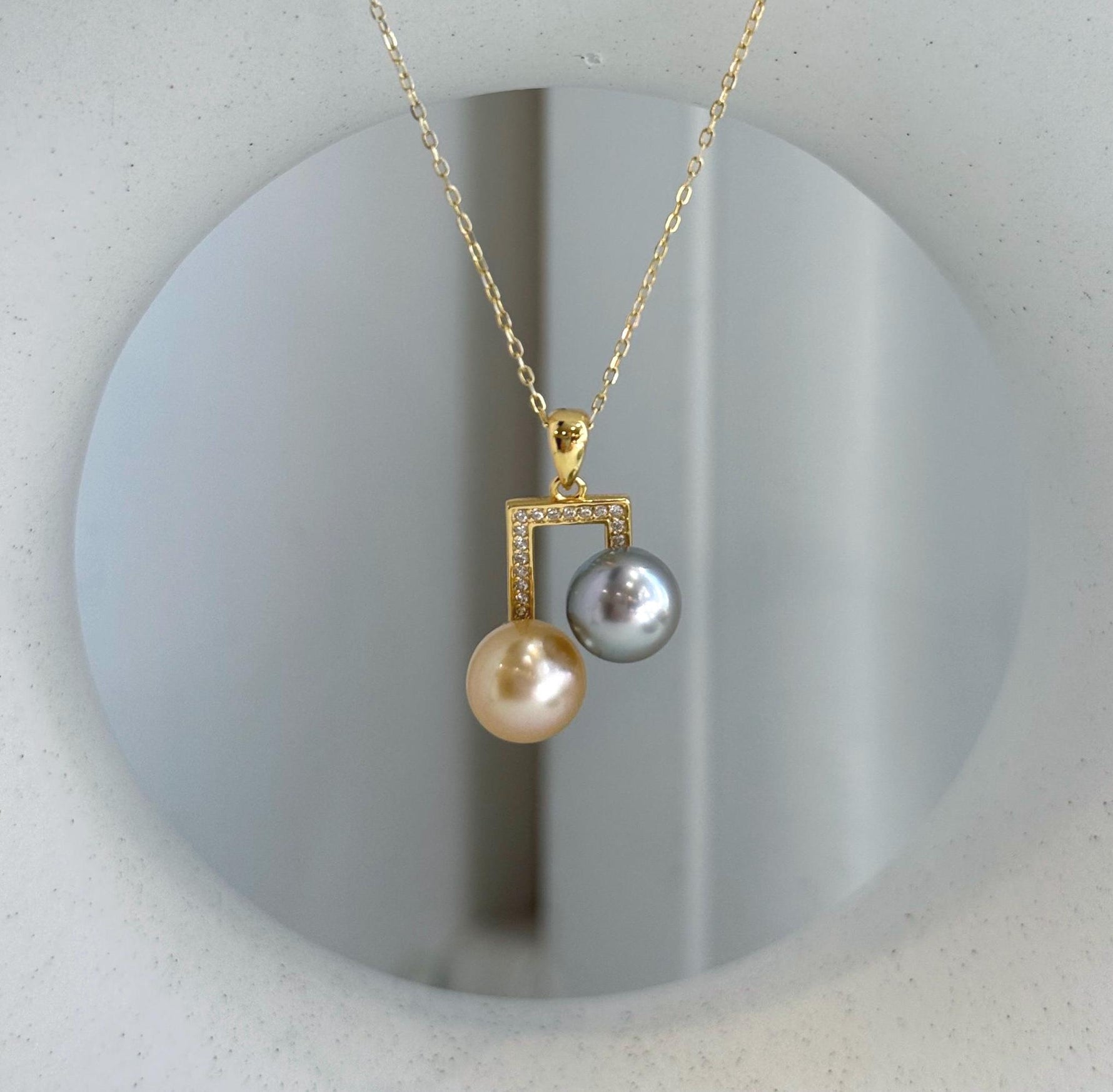 Modern double pearl necklace pendant crafted with genuine saltwater pearls.