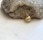Genuine golden South Sea saltwater pearl pendant featuring a rich deep tea gold color.