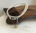 Elegant white pearl necklace set featuring a 4cm triple saltwater pearl dangle pendant.