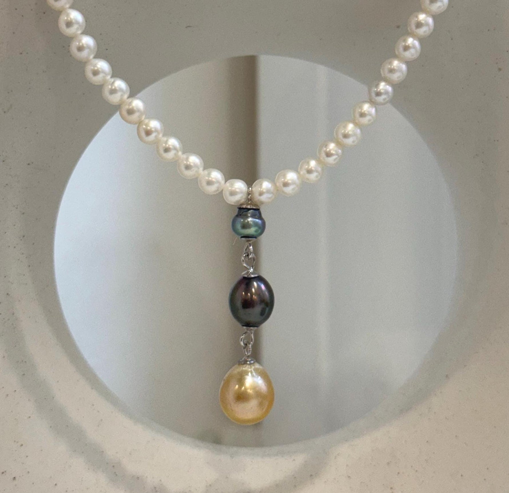 Genuine Tahitian and South Sea golden pearl pendant paired with a white freshwater pearl strand.