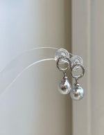 Genuine saltwater Akoya pearl earrings featuring luminous blue silver pearls