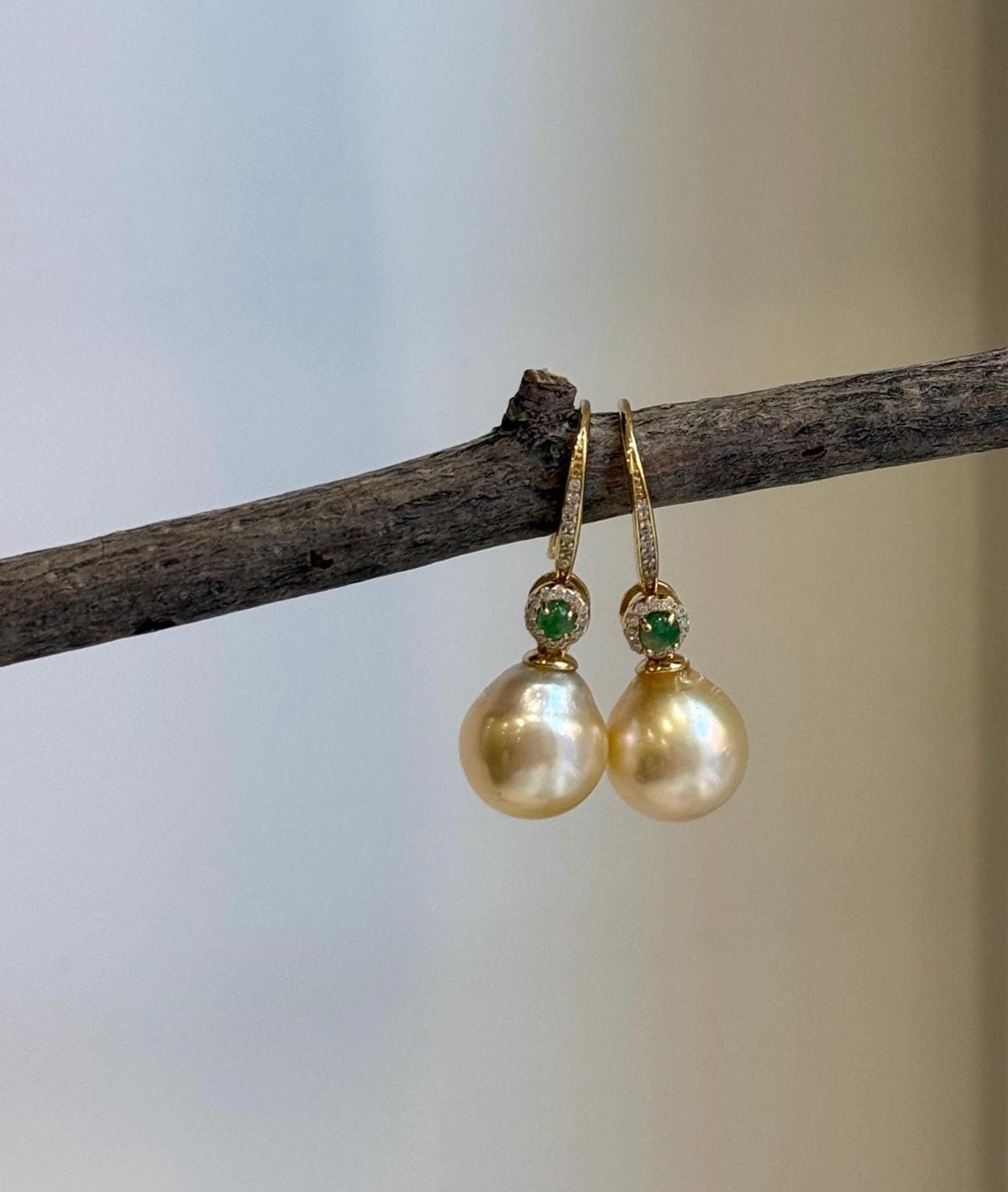Natural South Sea ultra gold pearl earrings with rich golden color and extreme reflective luster.
