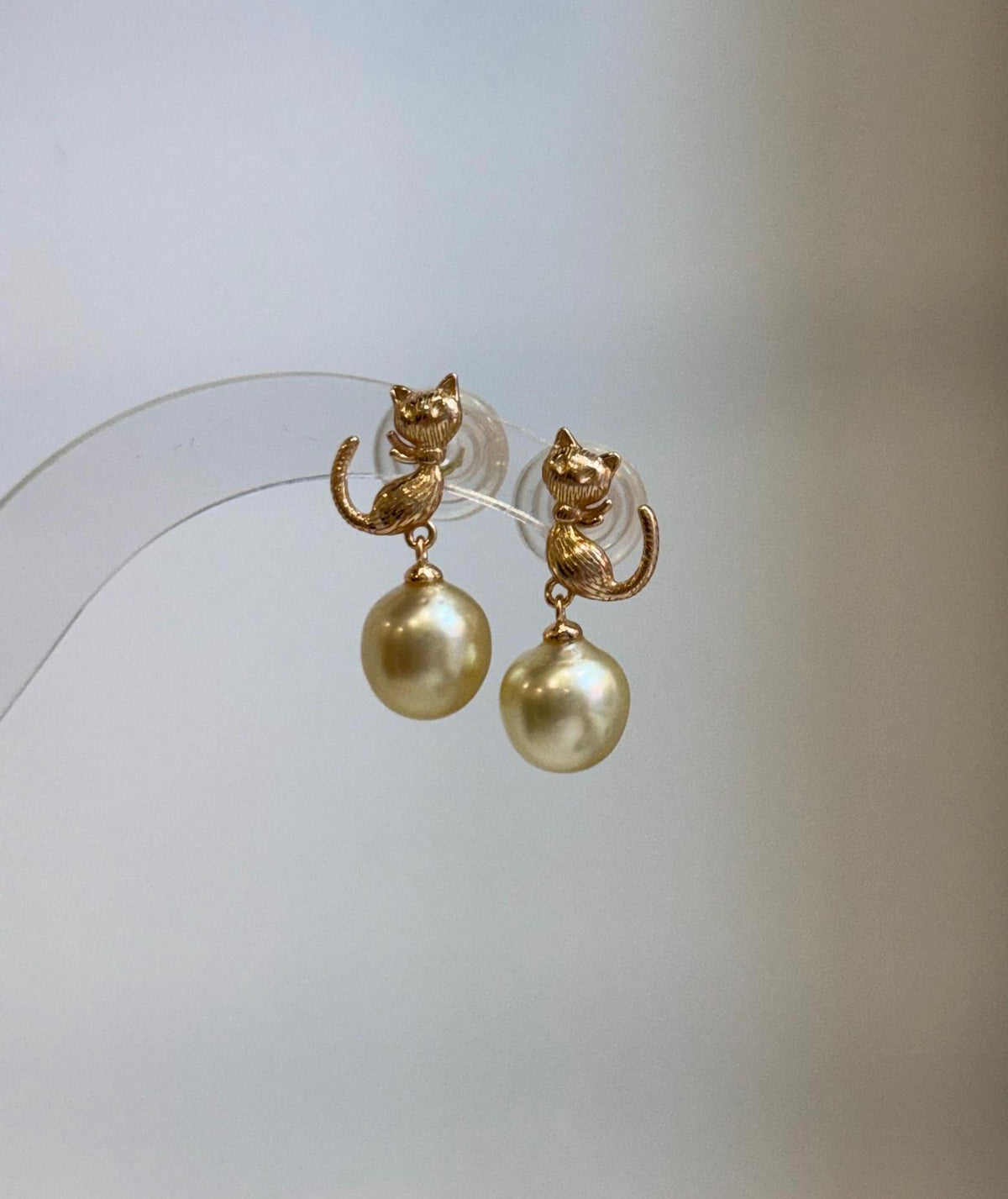 Close-up of 9.2mm genuine South Sea golden pearls showing their rich ultra gold color and extreme reflective luster.
