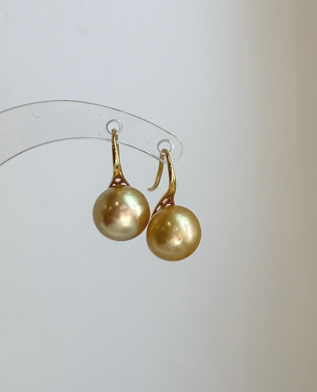 Mirror luster South Sea pearl earrings with stylish high heel design.