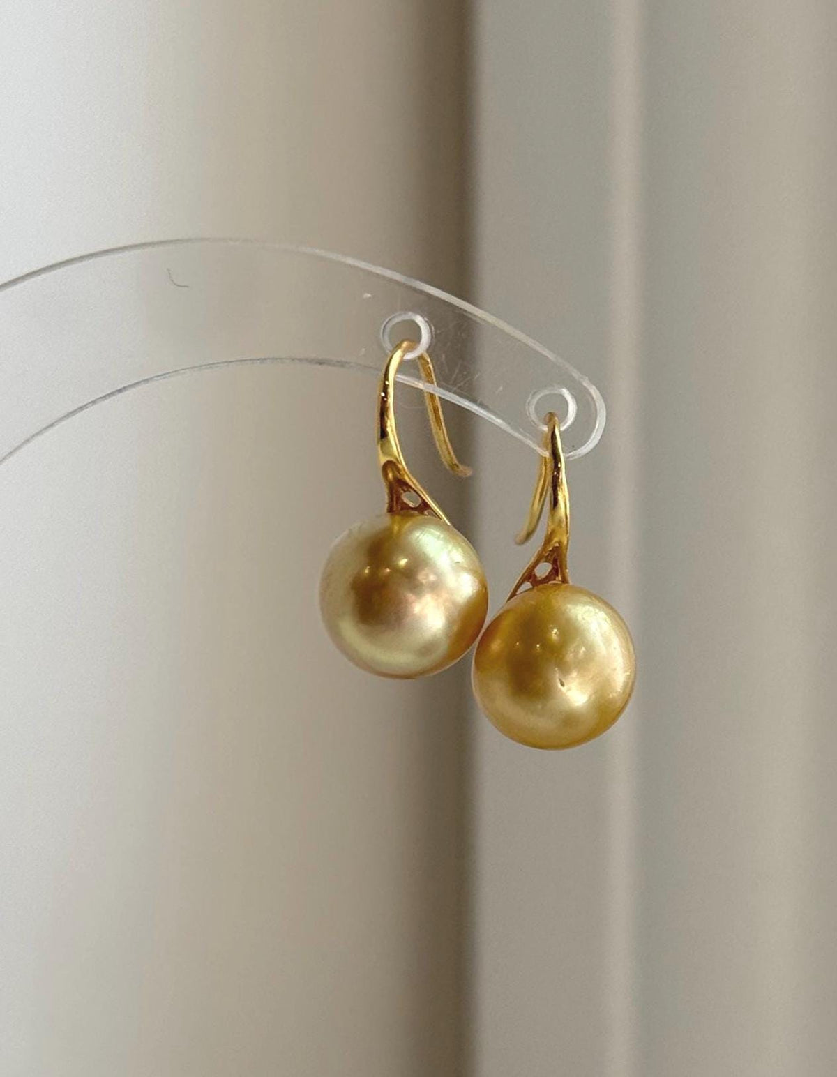 Genuine golden ocean pearl earrings handcrafted with sterling silver hooks.