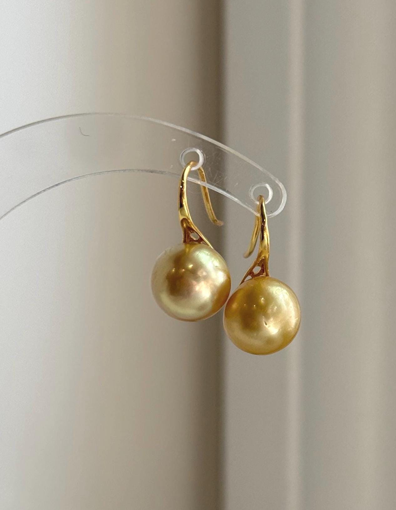 Genuine golden ocean pearl earrings handcrafted with sterling silver hooks.