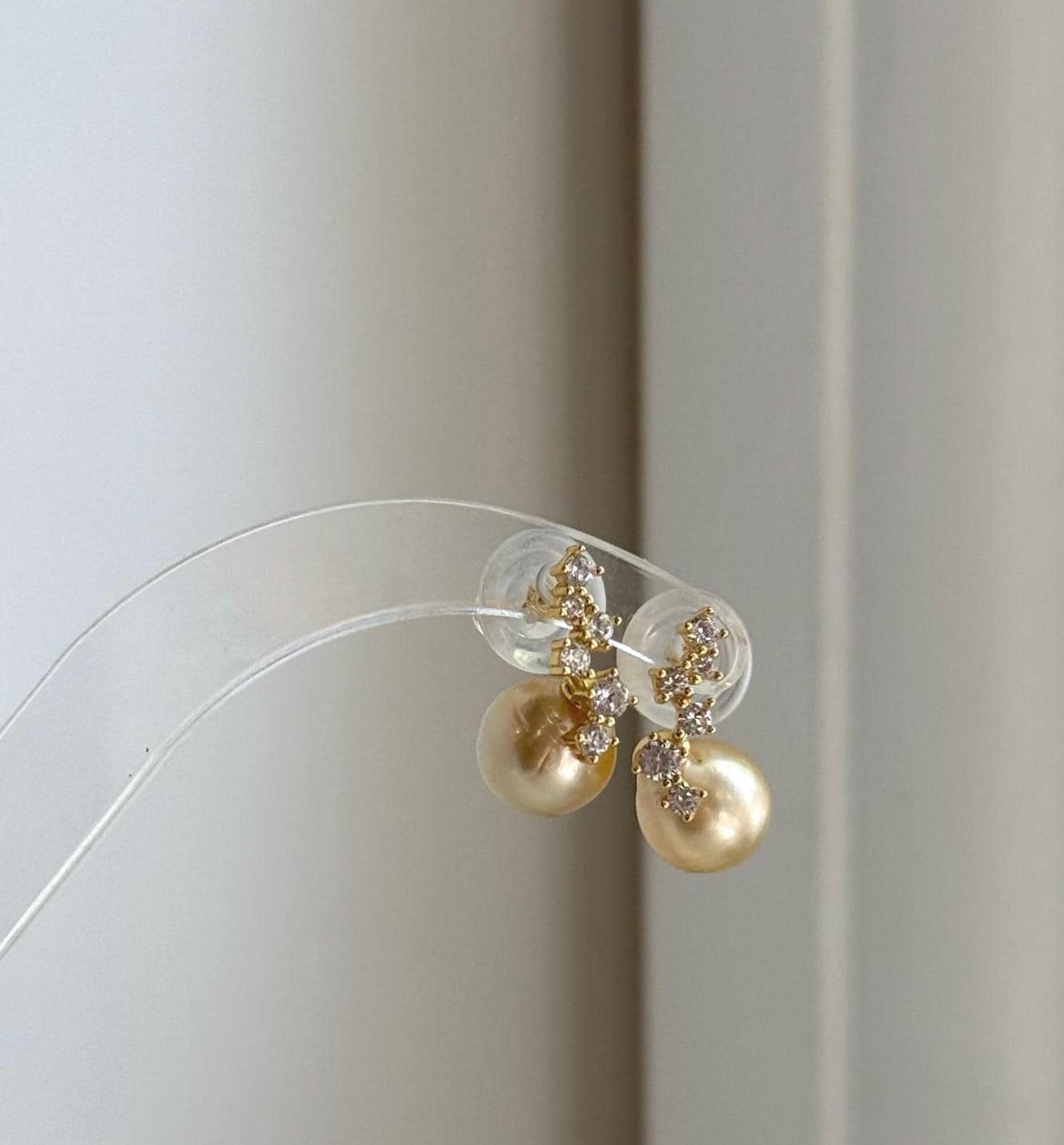 Elly’s 9.2mm genuine South Sea golden pearl earrings with exceptional mirror luster.