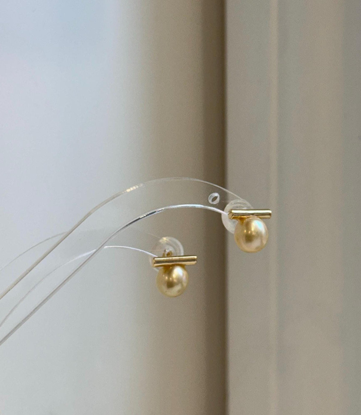 Genuine 8.8mm South Sea pearl earrings with rich natural golden color and elegant shine.