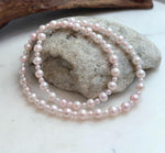 Elegant 18.7 inch pale pink freshwater pearl strand necklace with luminous mirror luster.