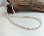 Pale pink freshwater pearl necklace featuring 3.5–6.5mm genuine pearls with beautiful mirror luster.